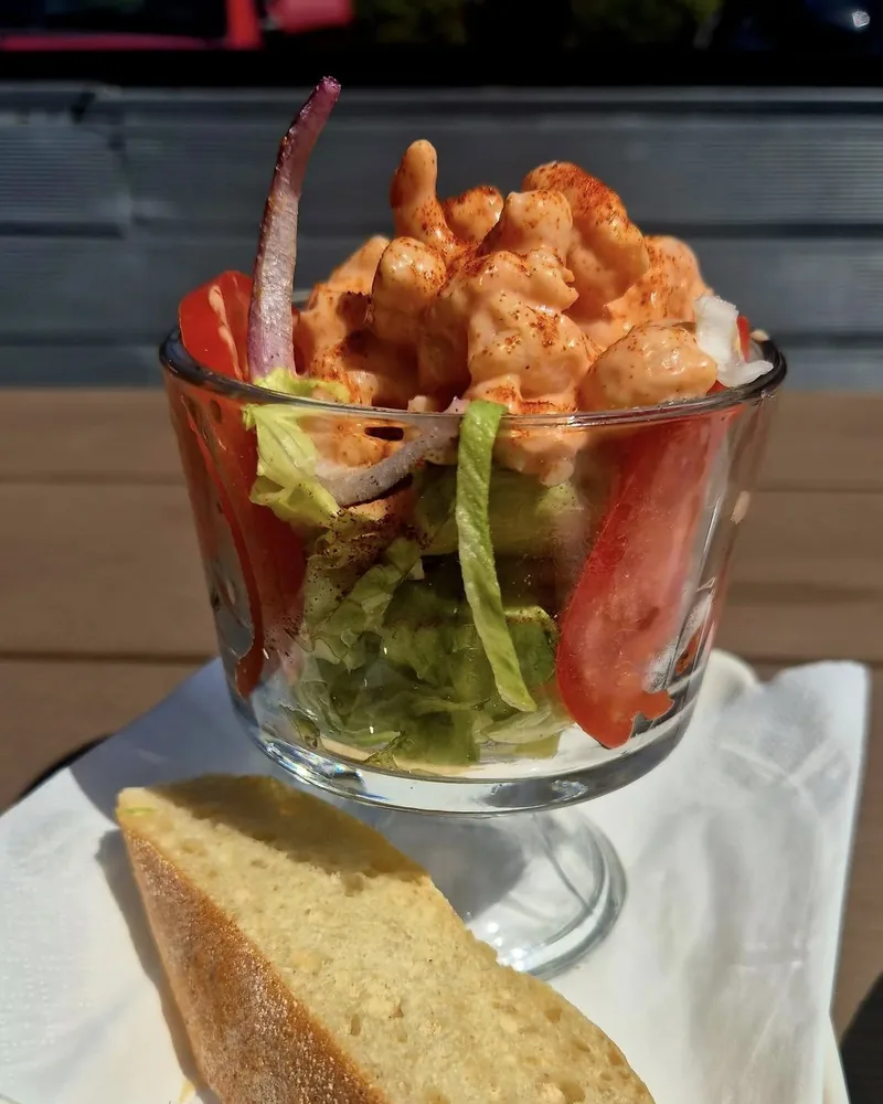 Classic prawn cocktail served in a glass with tomato, lettuce and toasted ciabatta